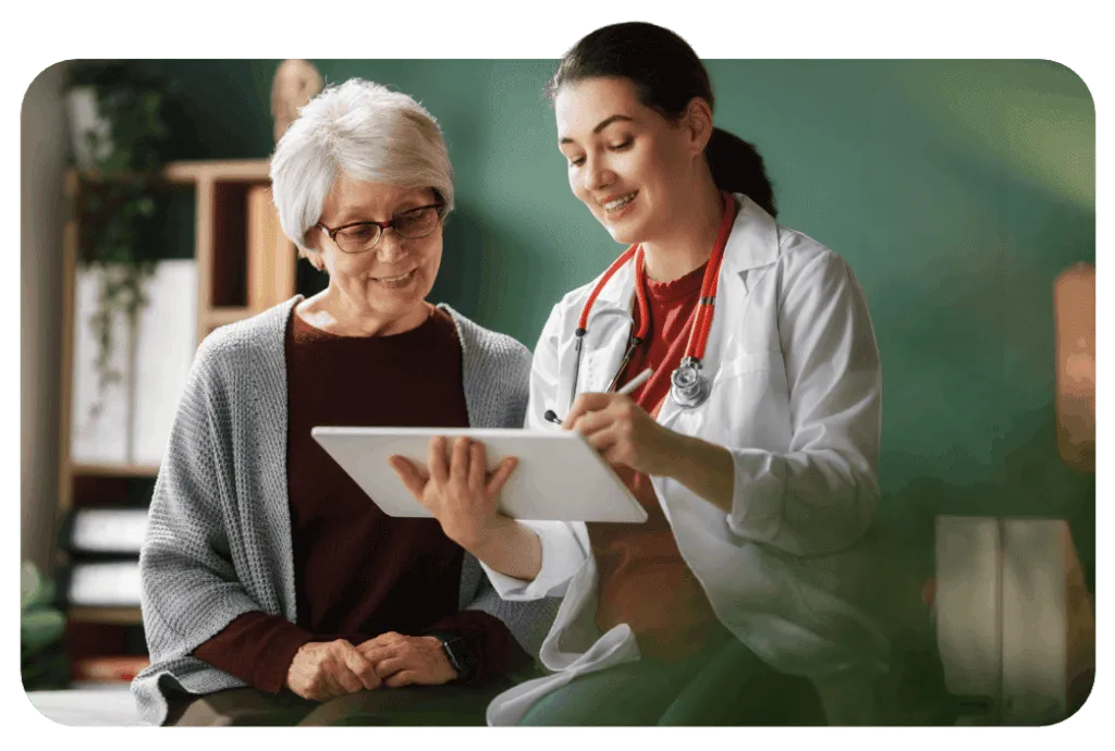 A Cano Health doctor reviews a chart with a patient.
